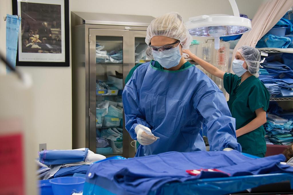 Two surgical tech students preparing to work