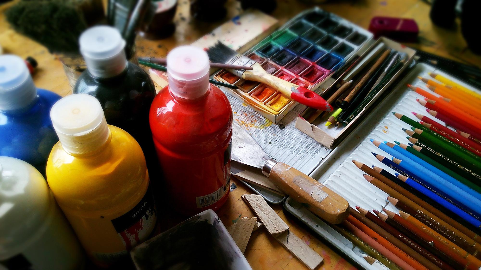 Art supplies, paints, brushes.